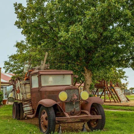 antique car sitting on grass