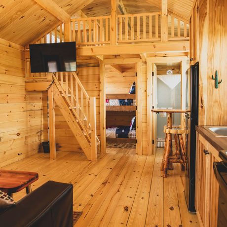 interior of cabin with furnishings and stairs